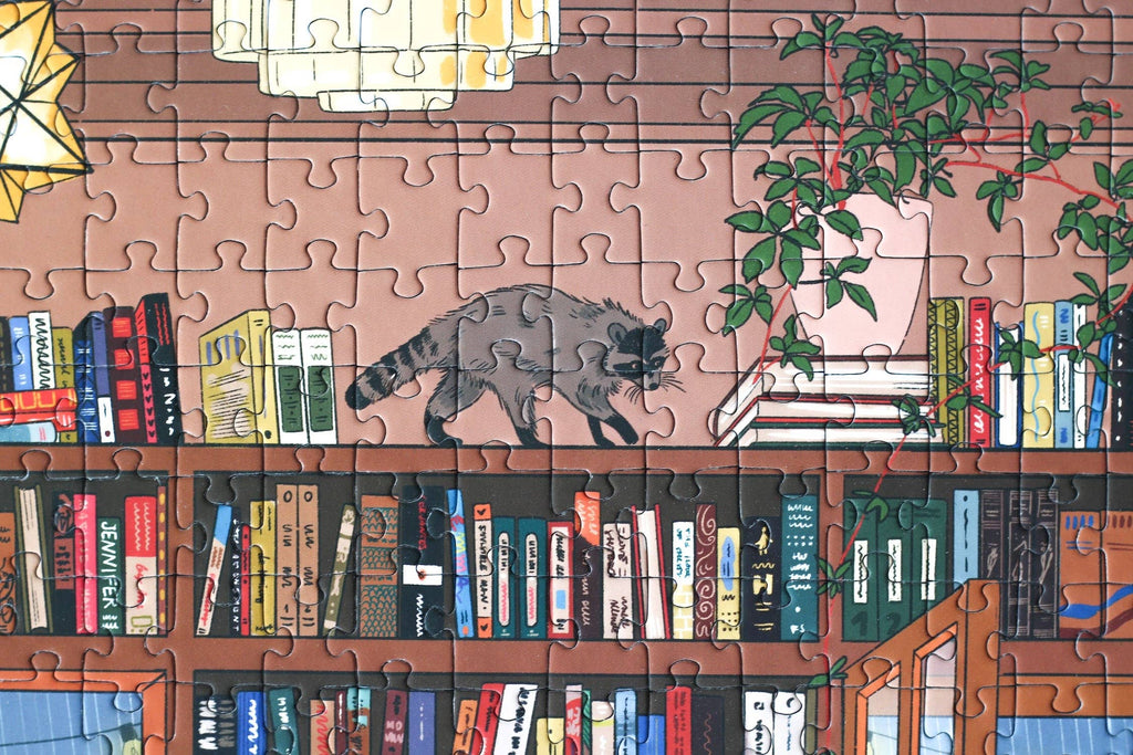 Book Nook jigsaw puzzle close up detail featuring a raccoon on a bookshelf.