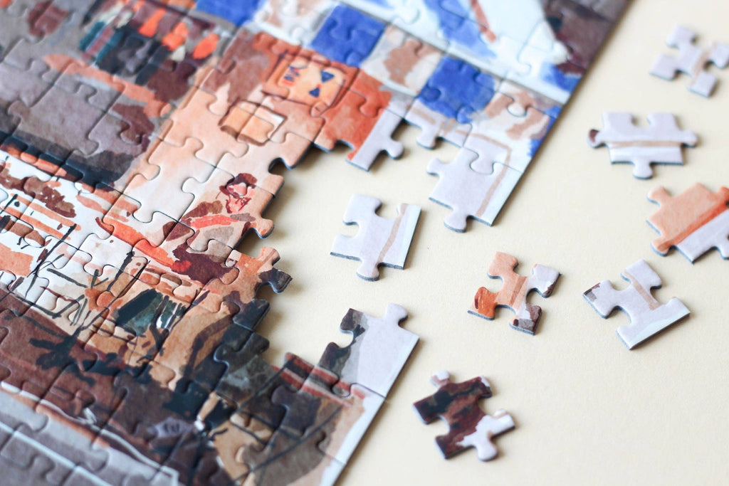 French Bistro jigsaw puzzle partially completed with edge close up.