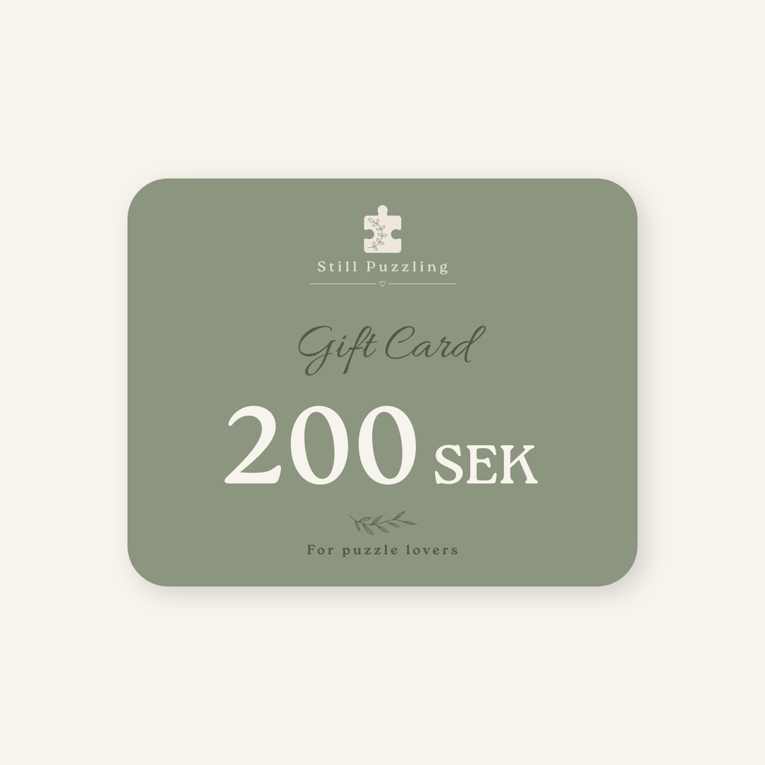 A rectangular puzzle-themed gift card with rounded corners in muted sage green, featuring white text that reads 'Still Puzzling', 'Gift Card', '200 SEK', and 'For puzzle lovers' on a light cream background.