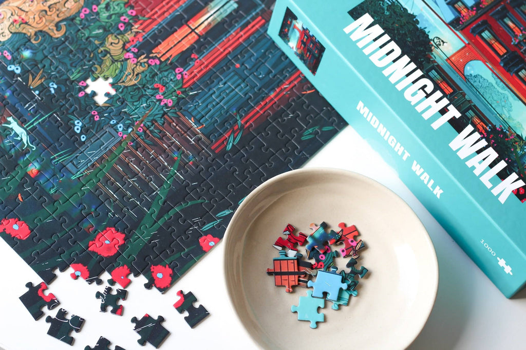Midnight Walk jigsaw puzzle partially completed next to a puzzle box.
