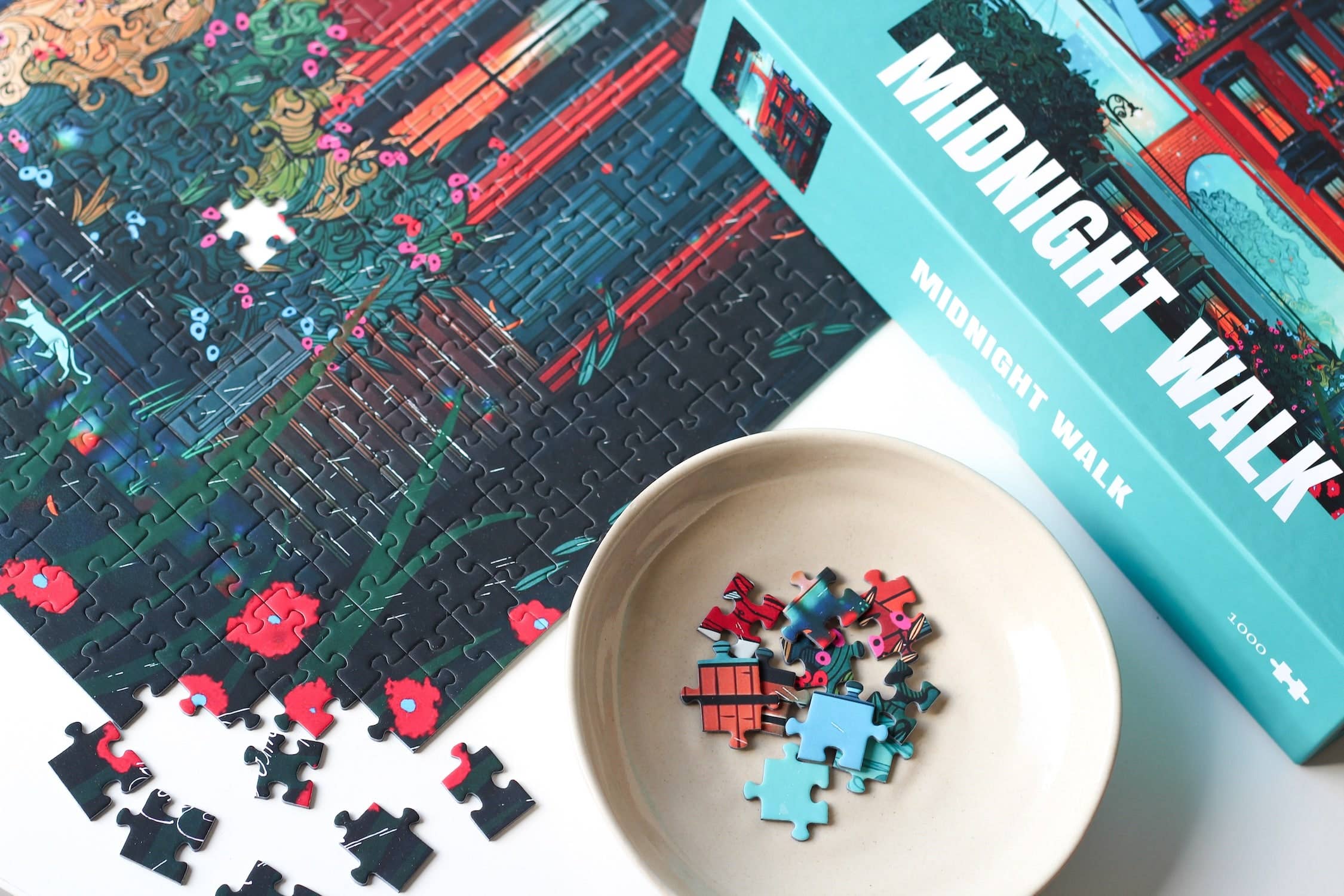 Midnight Walk jigsaw puzzle partially completed next to a puzzle box.
