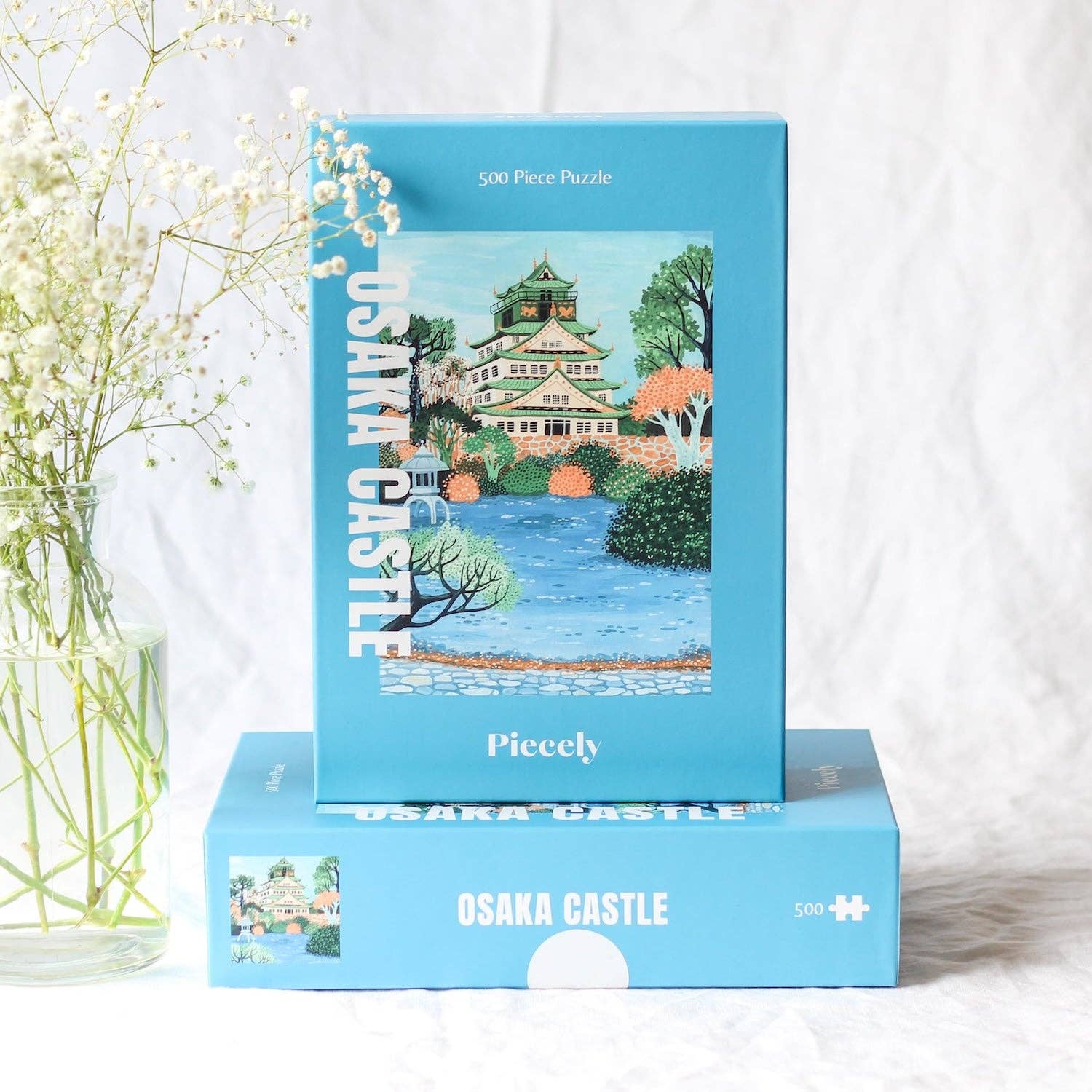Osaka Castle jigsaw puzzle boxes stacked and displayed on a clear background