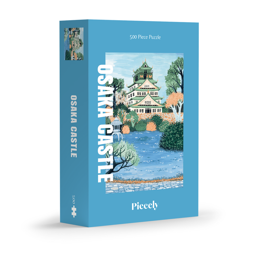 Osaka Castle 500-piece jigsaw puzzle by Piecely, featuring the famous Japanese landmark surrounded by water and plants. Inspirerat av Japan — pussel för vuxna.