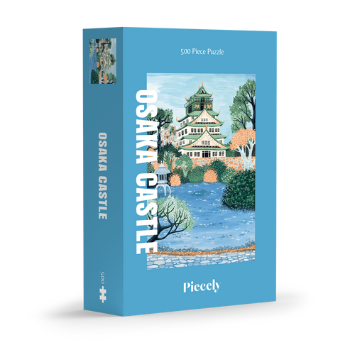 Osaka Castle 500-piece jigsaw puzzle by Piecely, featuring the famous Japanese landmark surrounded by water and plants. Inspirerat av Japan — pussel för vuxna.