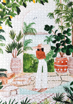 Peaceful Morocco jigsaw puzzle complete with illustration of a woman posing around plants and cozy view.