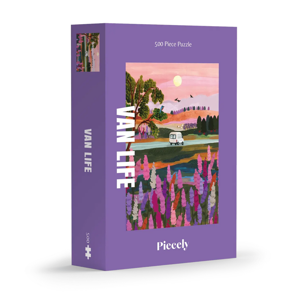 Van Life 500-piece jigsaw puzzle by Piecely, featuring a camper van driving through a scenic landscape at sunset with blooming flowers in the foreground. Ett pussel för vuxna med tema resor och äventyr.